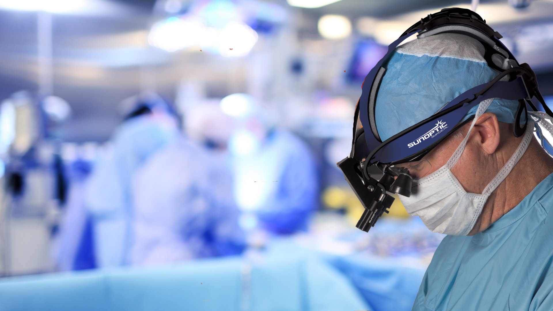A surgeon in an operating room wearing a Sunoptic Surgical headlight
